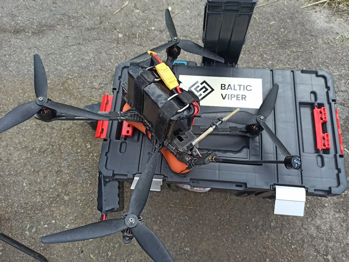 Baltic Viper UAV drone placed on a branded equipment case during outdoor field testing.